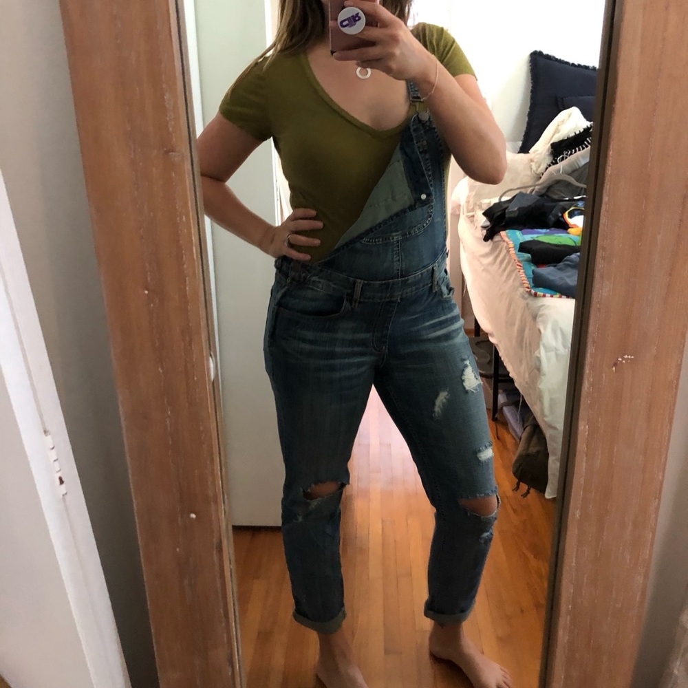 Distressed denim overalls